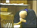 Bob Alexander prays before administering justice